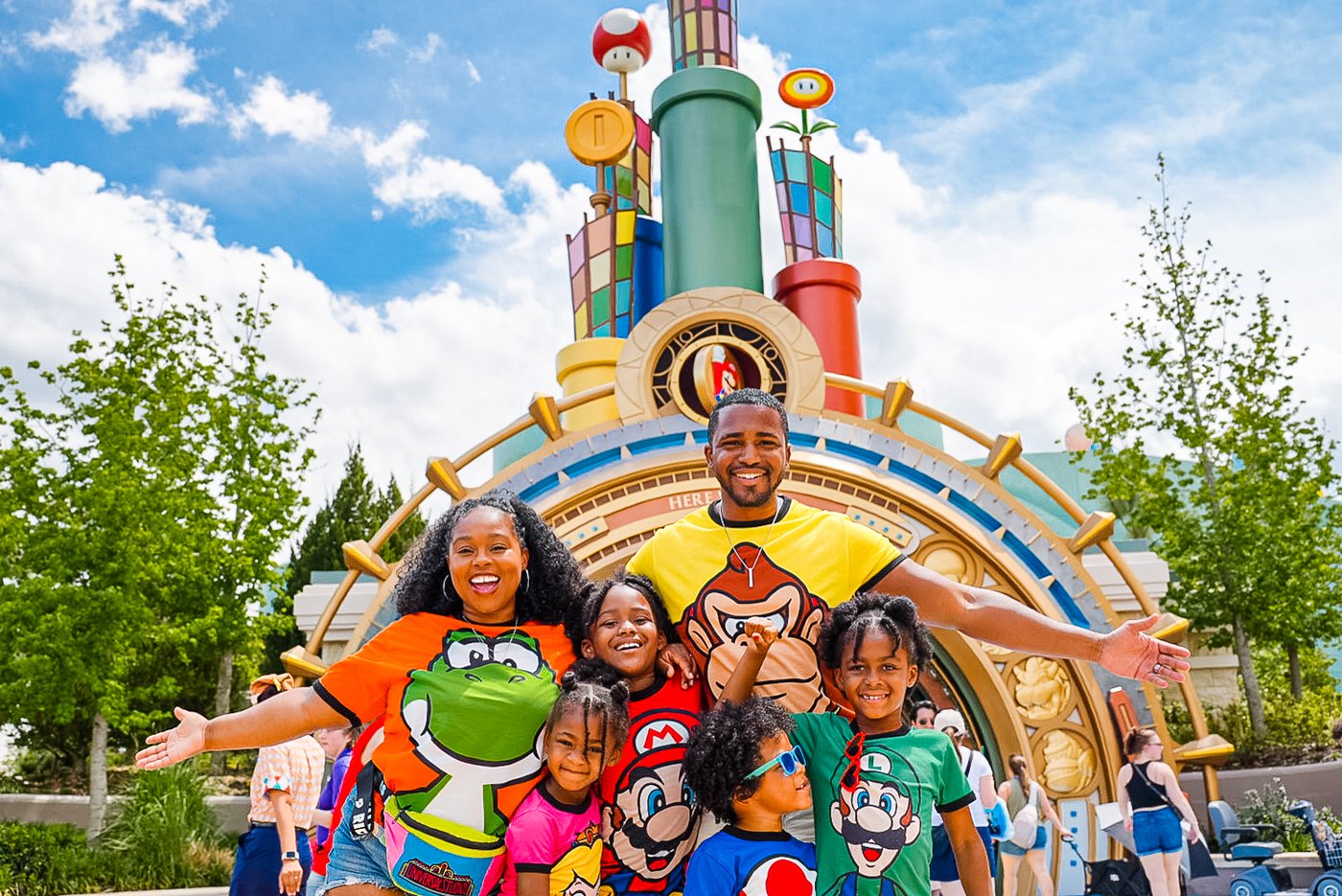 The Roberson family in matching Nintendo outfits at Super Nintendo World Epic Universe