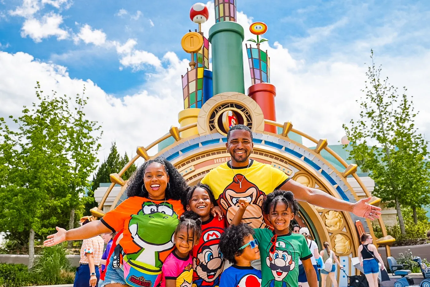 The Roberson family in matching Nintendo outfits at Super Nintendo World Epic Universe