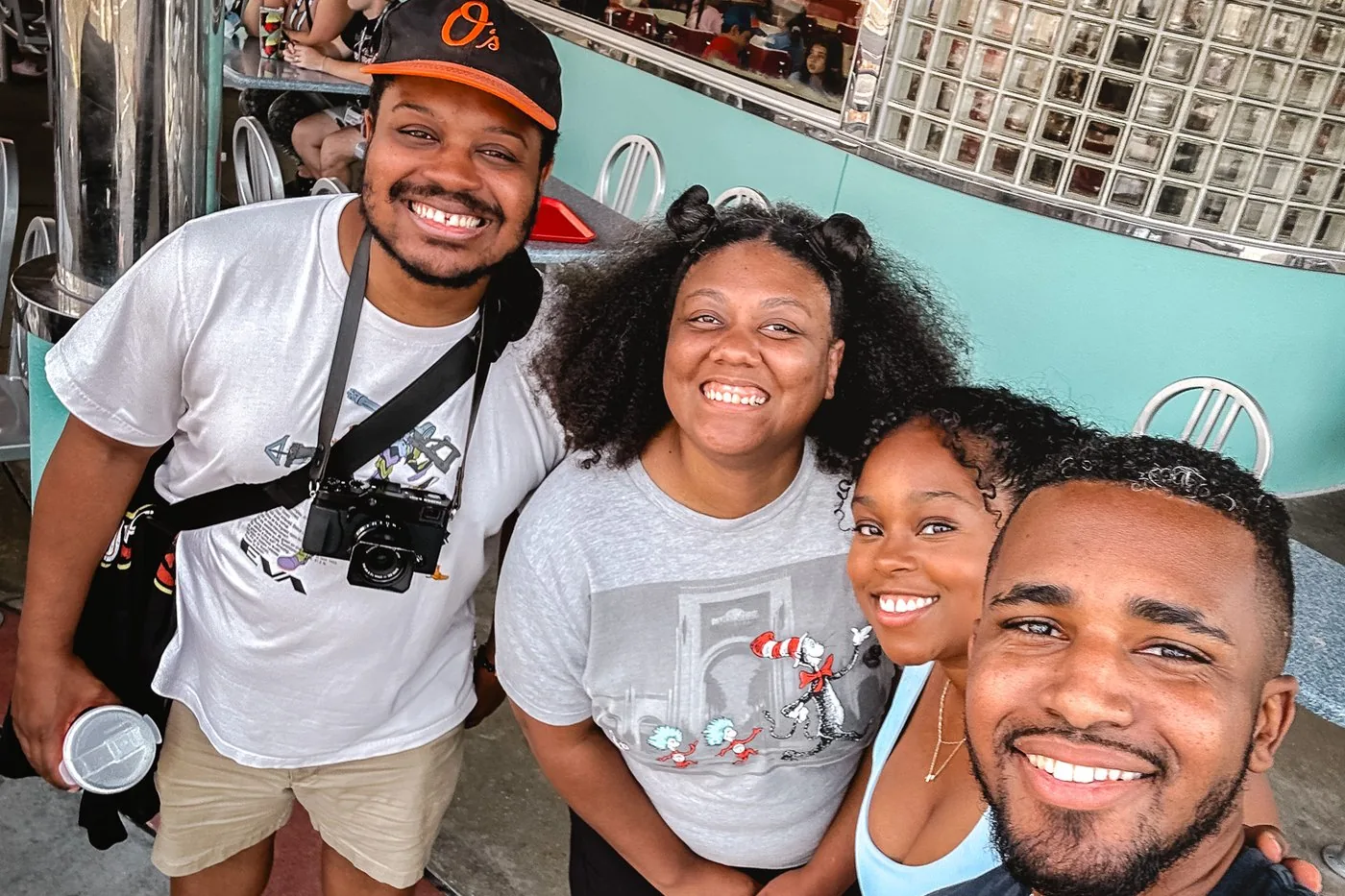 Jordan Roberson with camera gear alongside Kristen from Wright Down Main Street and other creators at Universal Orlando