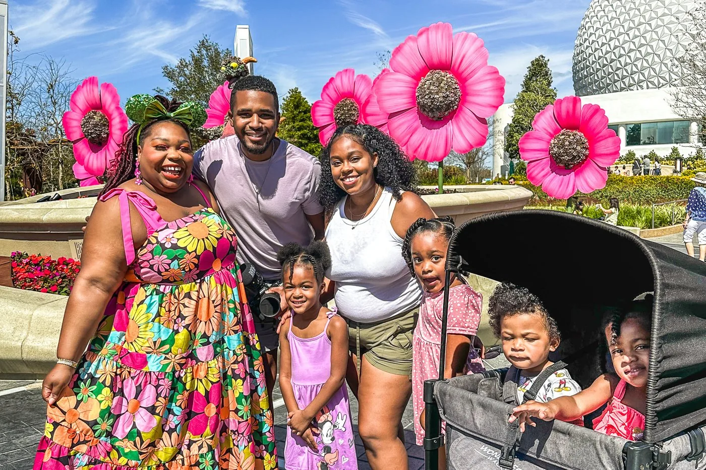 The Roberson family at EPCOT Flower and Garden Festival with the Wonderfold Wagon alongside a fellow creator