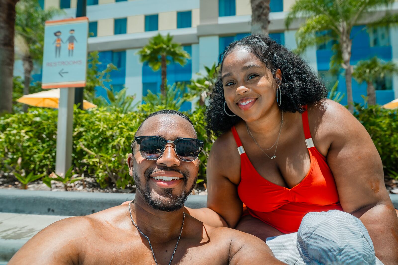 Jordan and Ashly Roberson smiling poolside at Universal's Endless Summer Resort Dockside