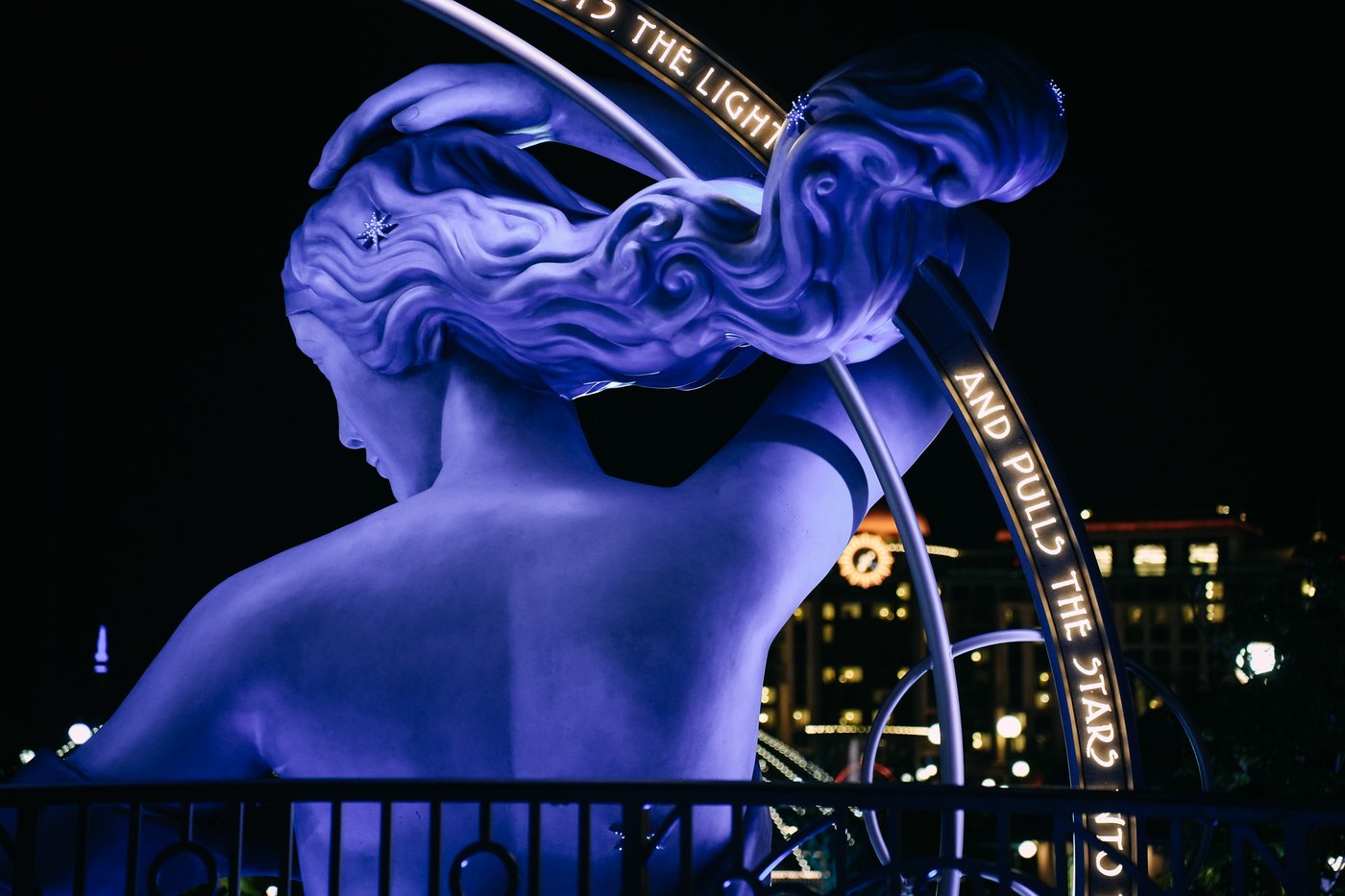 The Luna statue at Epic Universe Celestial Park at night