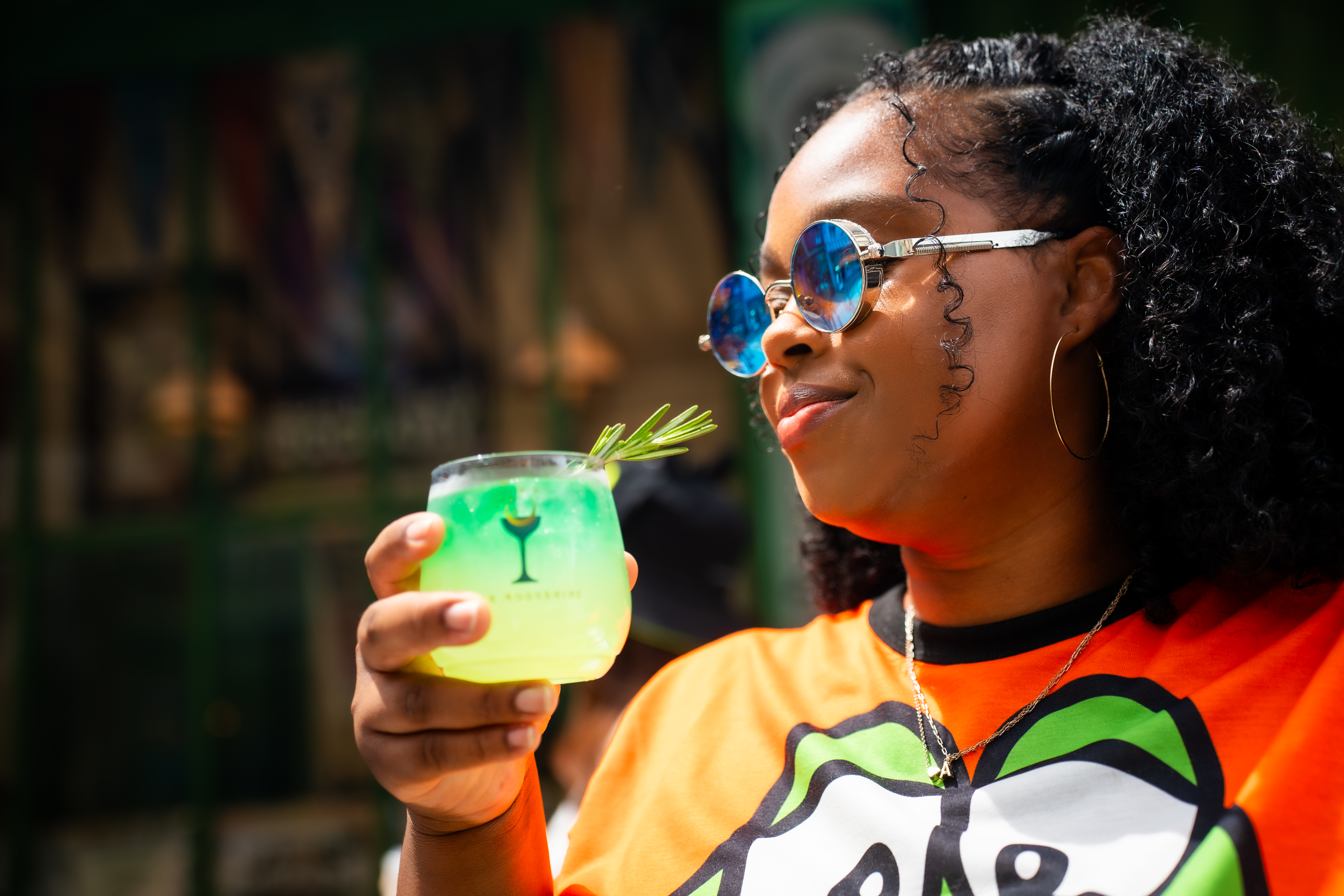 Ashly Roberson holding a green cocktail at the Orlando Informer Meetup